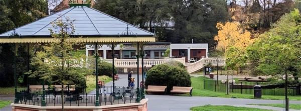 Image shows Ellington Park including the bandstand, and the cafe in the background